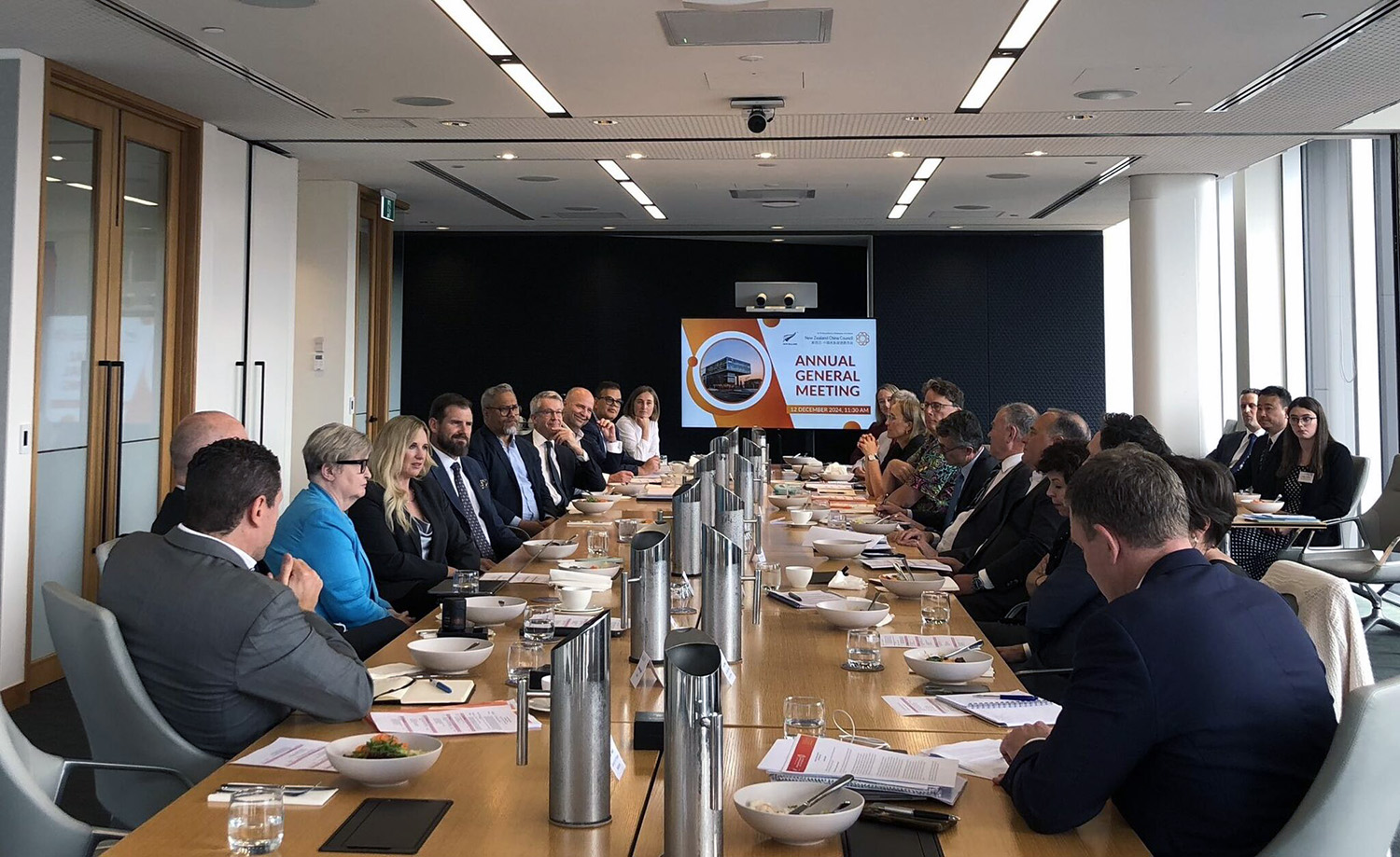 A boardroom with NCCC board members sitting around a long table