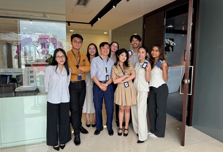 Beth and colleagues posing for a photo in their office
