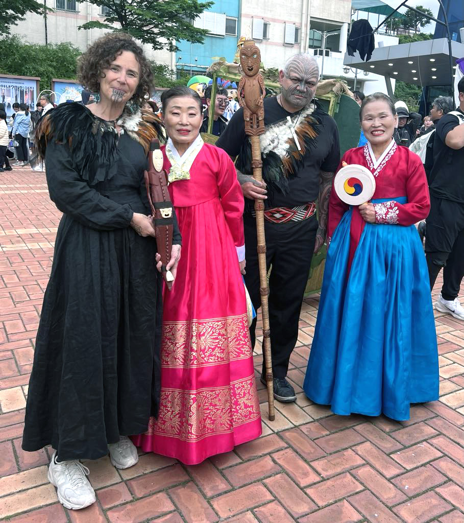 Hinemoa Jones and James Webster with two women in traditional Korean dress