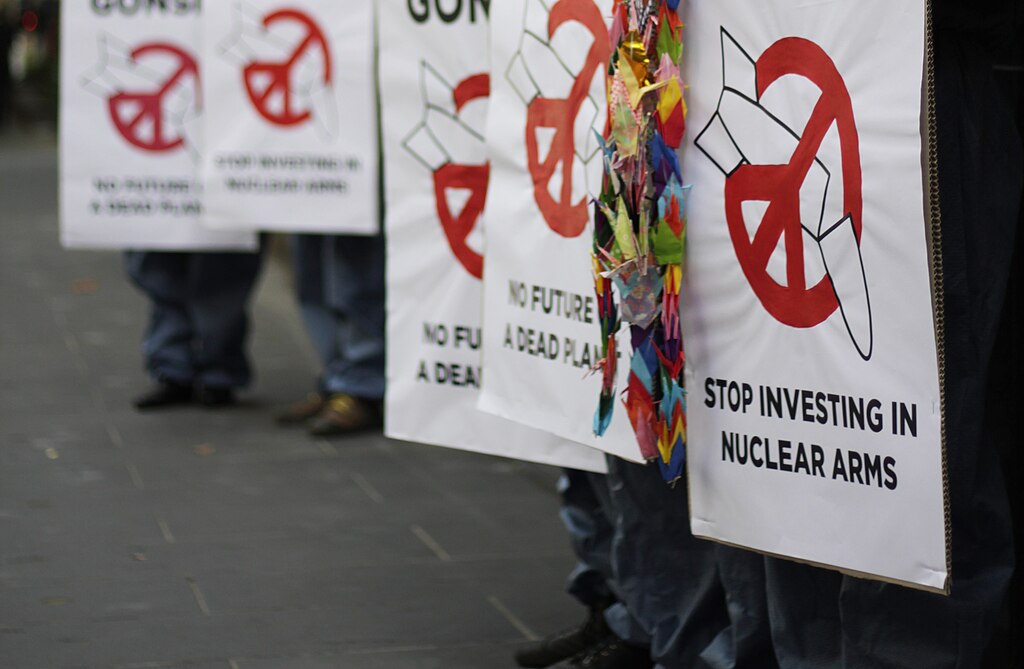 An image of people holding anti-nuclear signs
