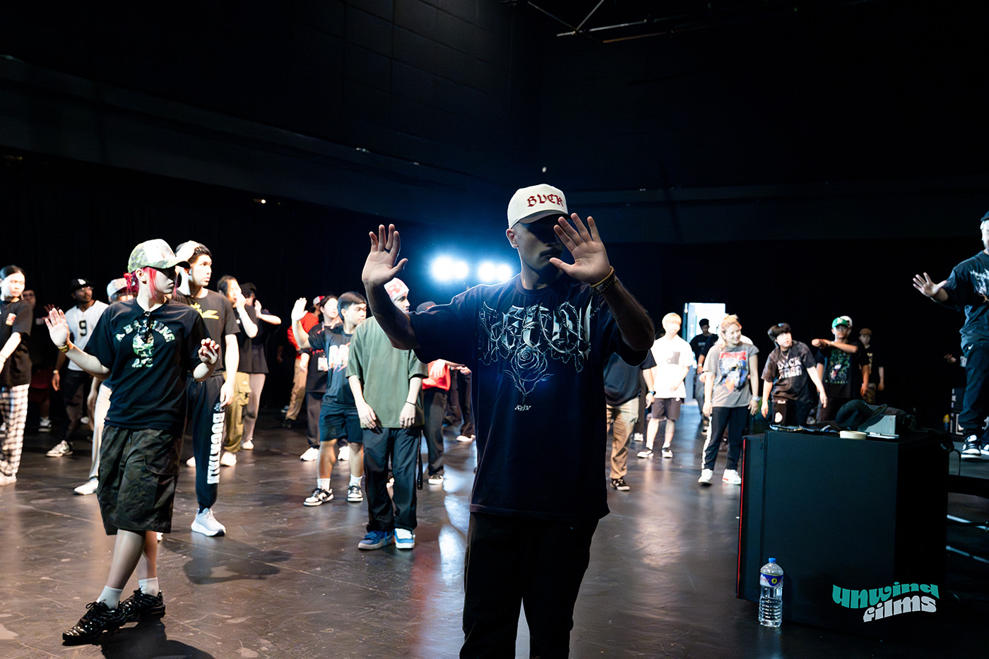 Trenten on stage practicing moves as part of a group workshop