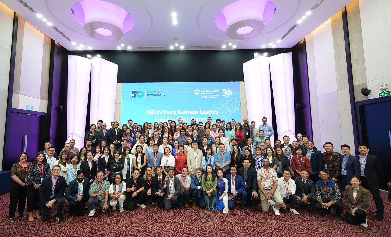 A group photo in a conference room of all the 120 delegates and Foundation staff