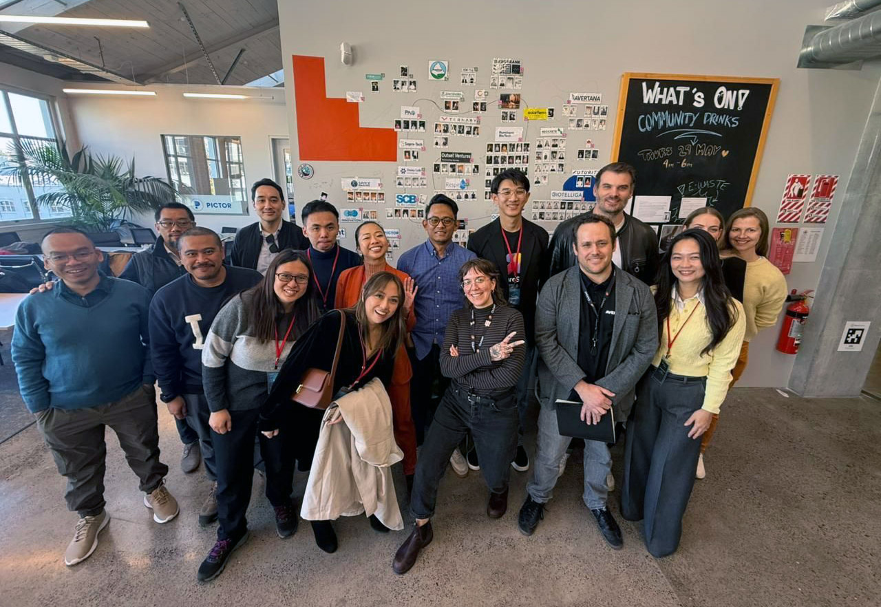 The entrepreneurs posing for a group photo with representatives from  Outset Ventures