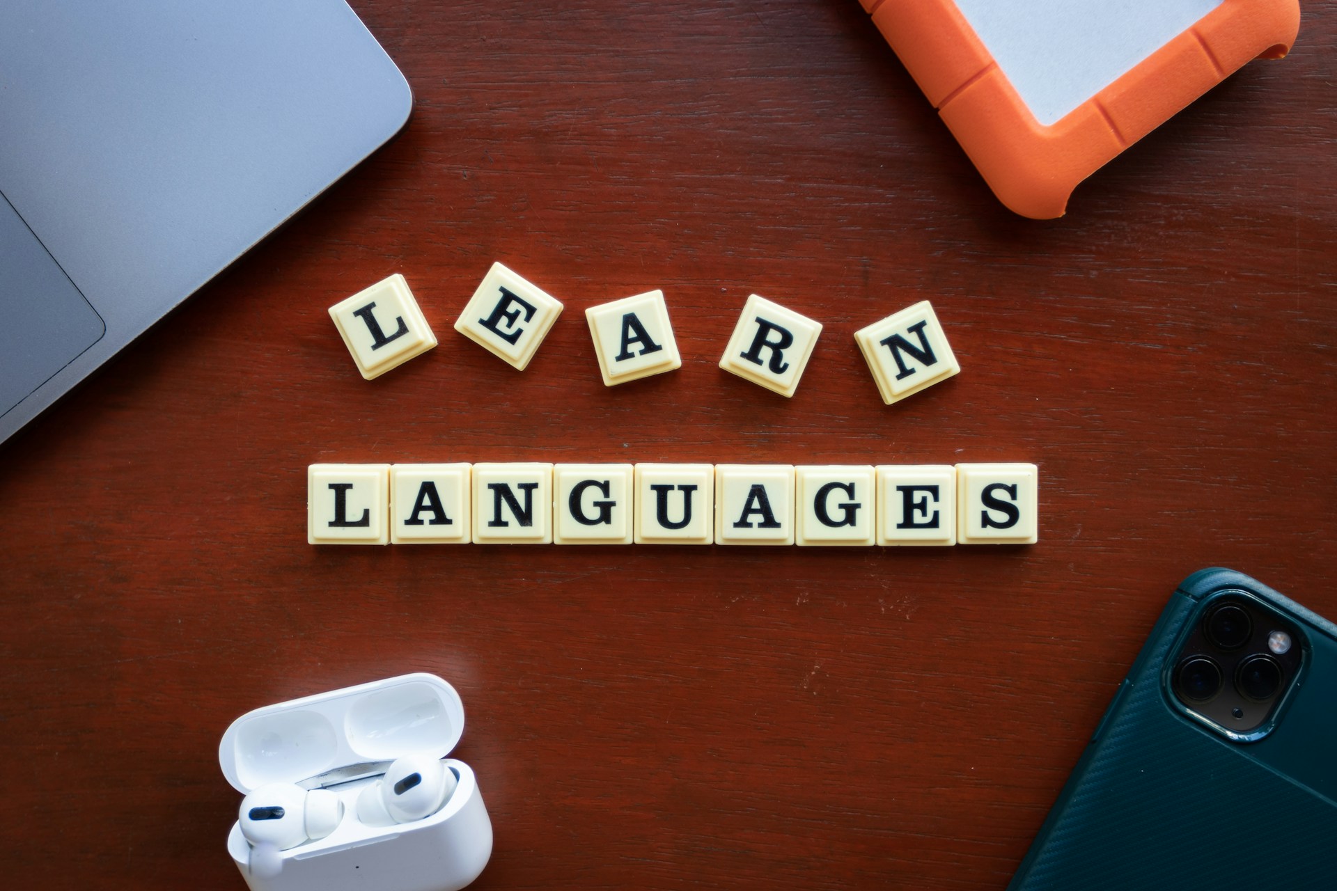 Scrabble tiles spelling out 'Learn Languages'