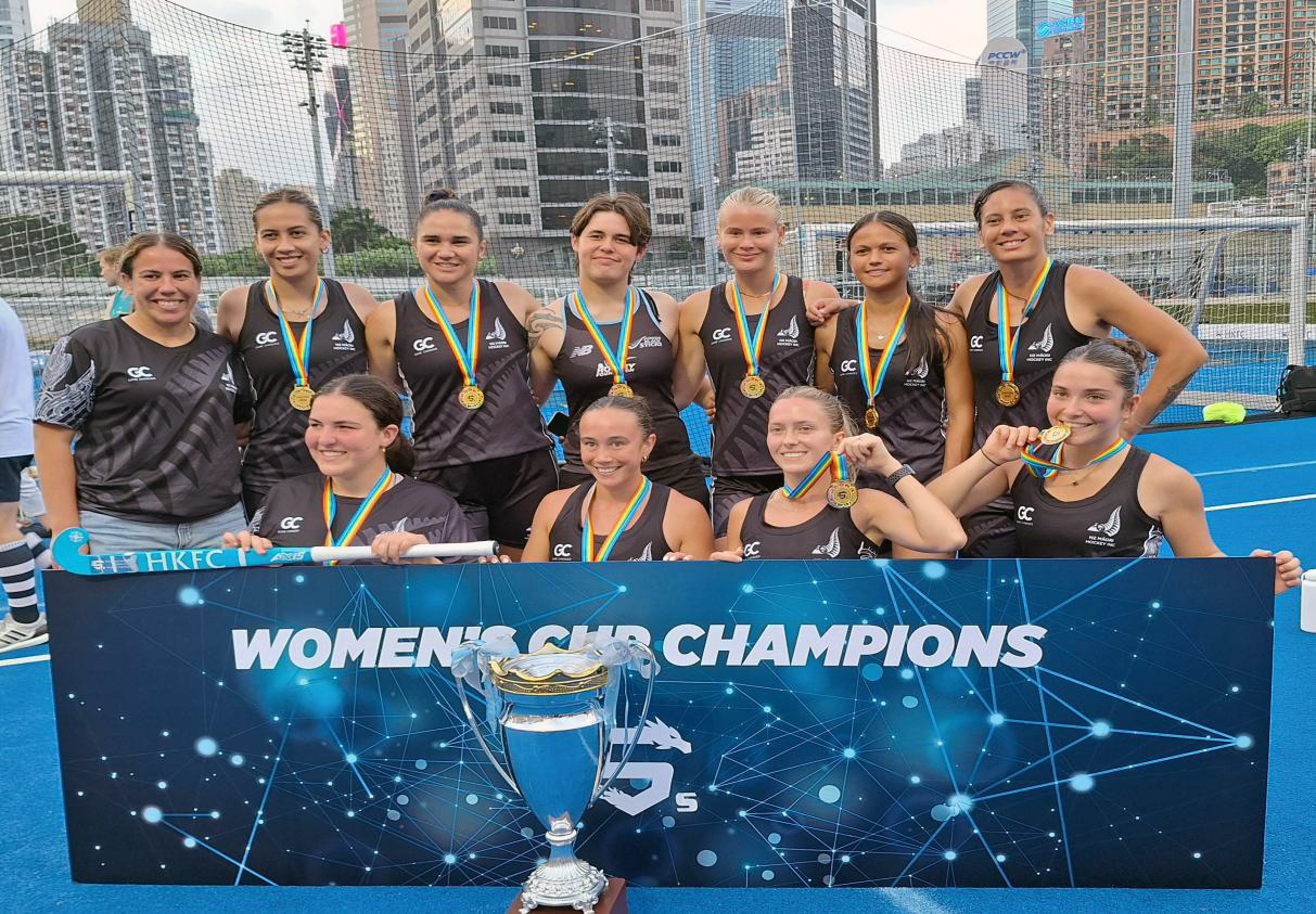 The women's team posing with their gold medals
