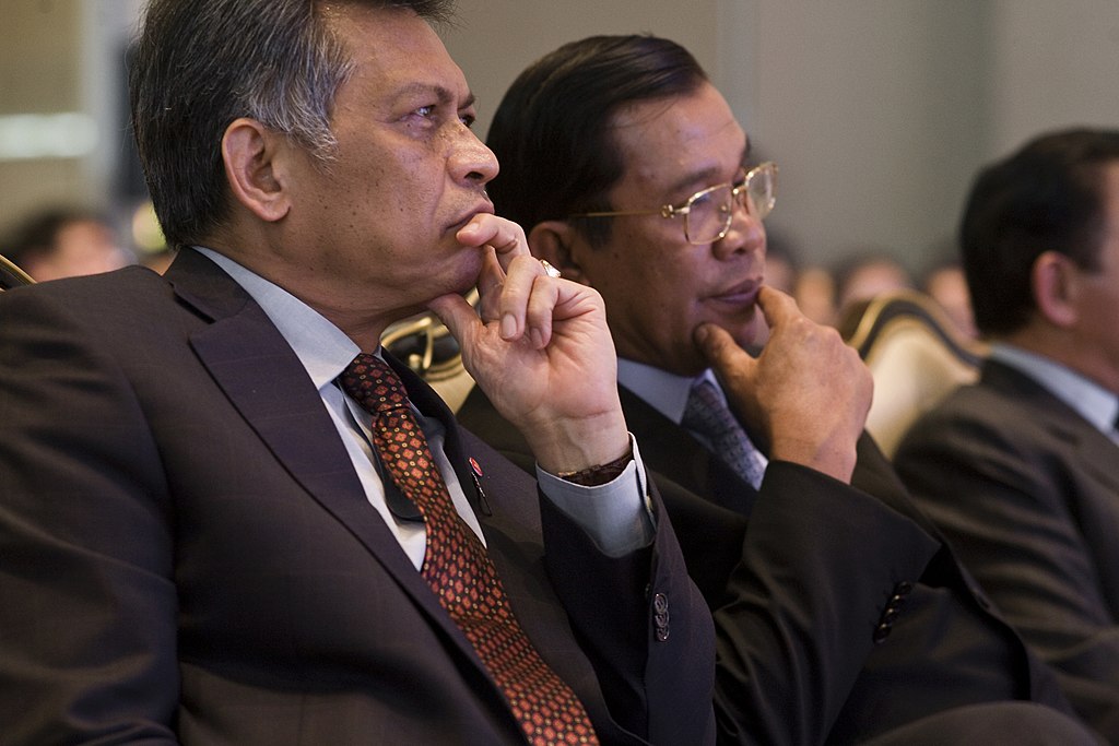 Hun Sen sitting in a meeting