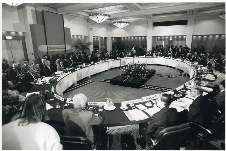 APEC ministers sitting around a large oval table