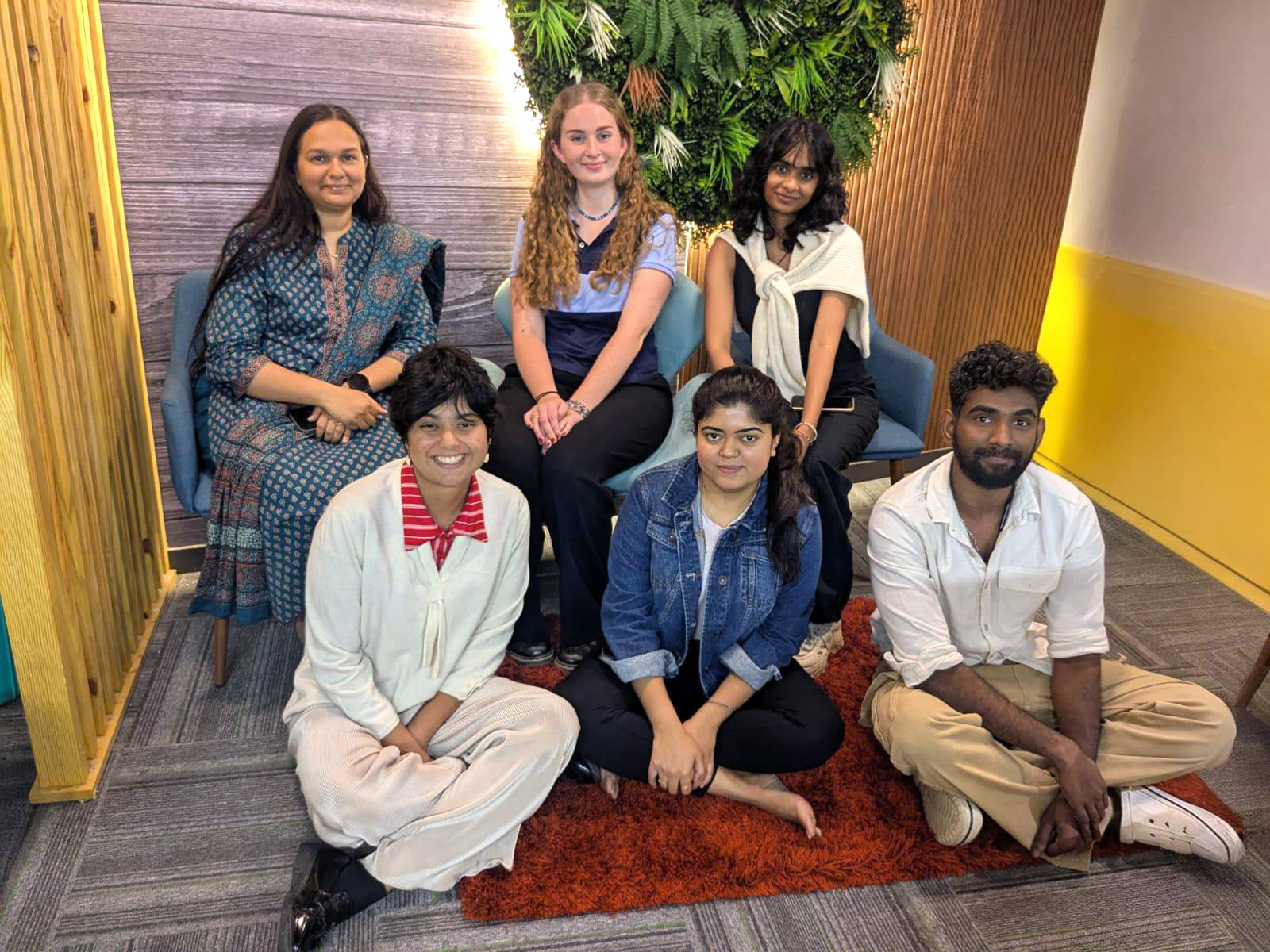 Allison posing for a photo with five UrbanPiper staff members