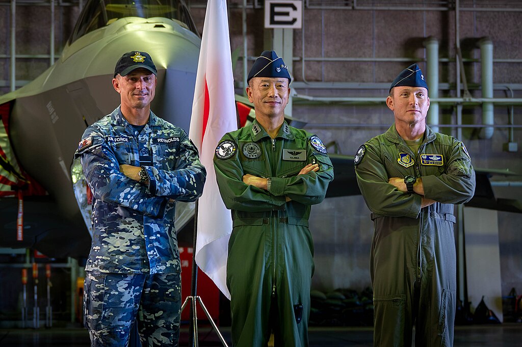 Australian, Japanese and US commanders pose for a photo in front of a fighter jet following Exercise Bushido Guardian 25