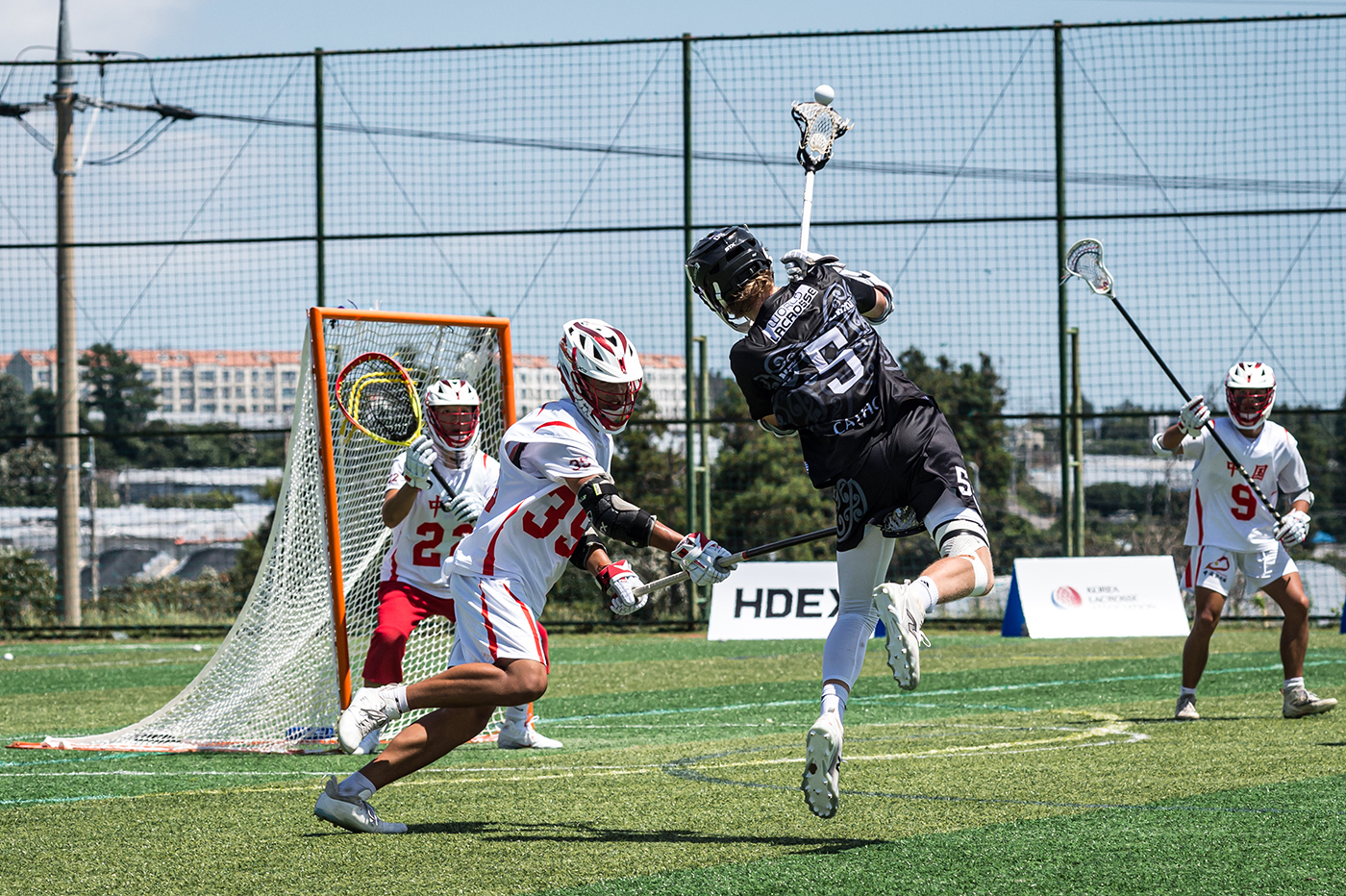 A New Zealand player taking a shot on goal