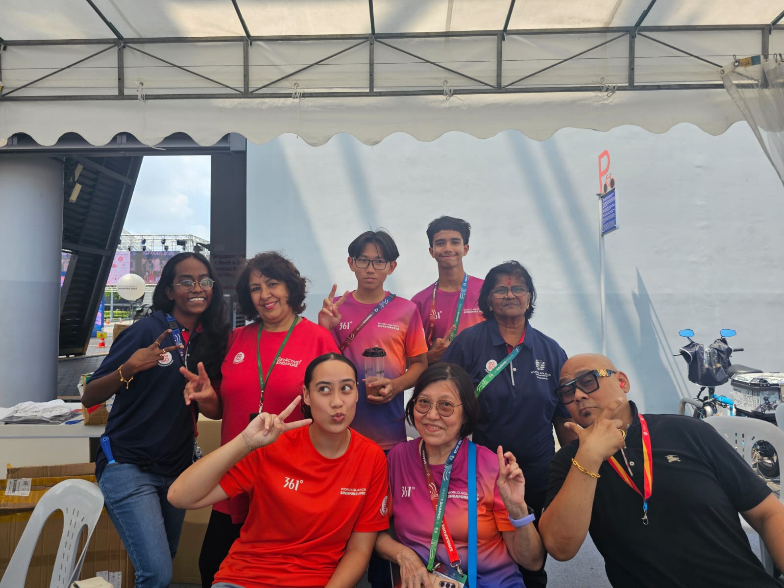 Ana-Rachel posing with World Aquatic campionships staff