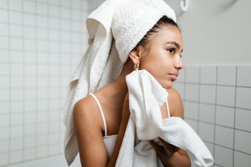 woman dries off after shower