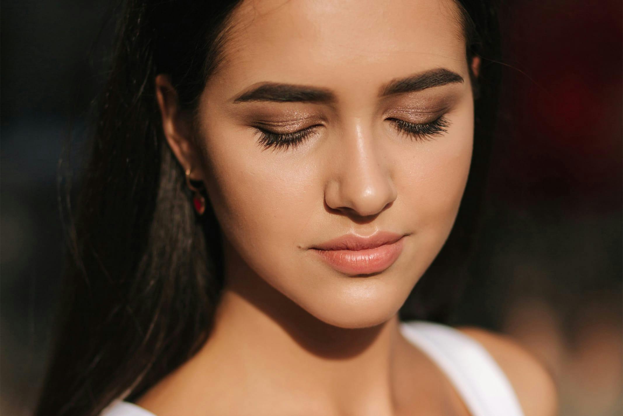 woman with eyes closed