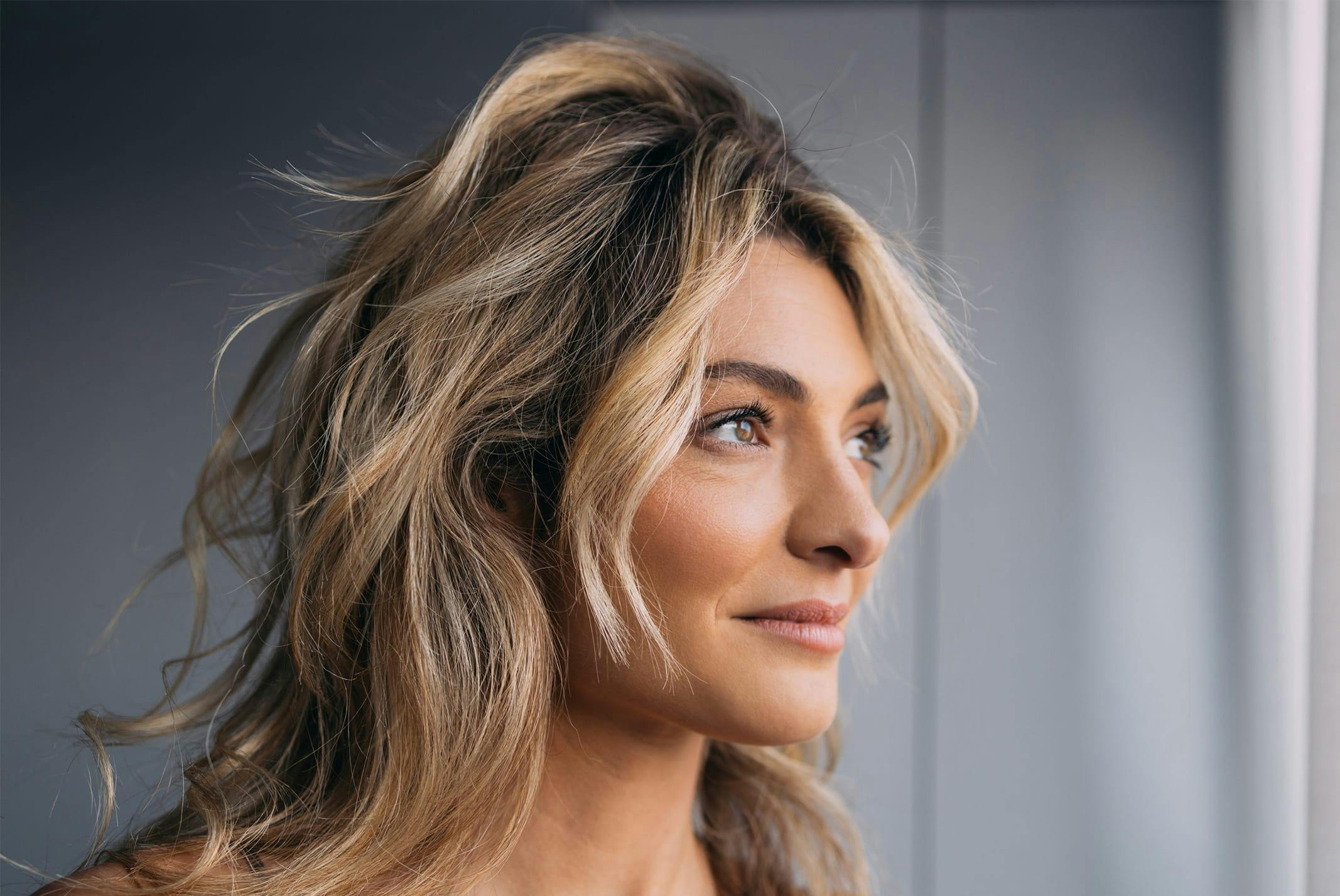 woman looking out window