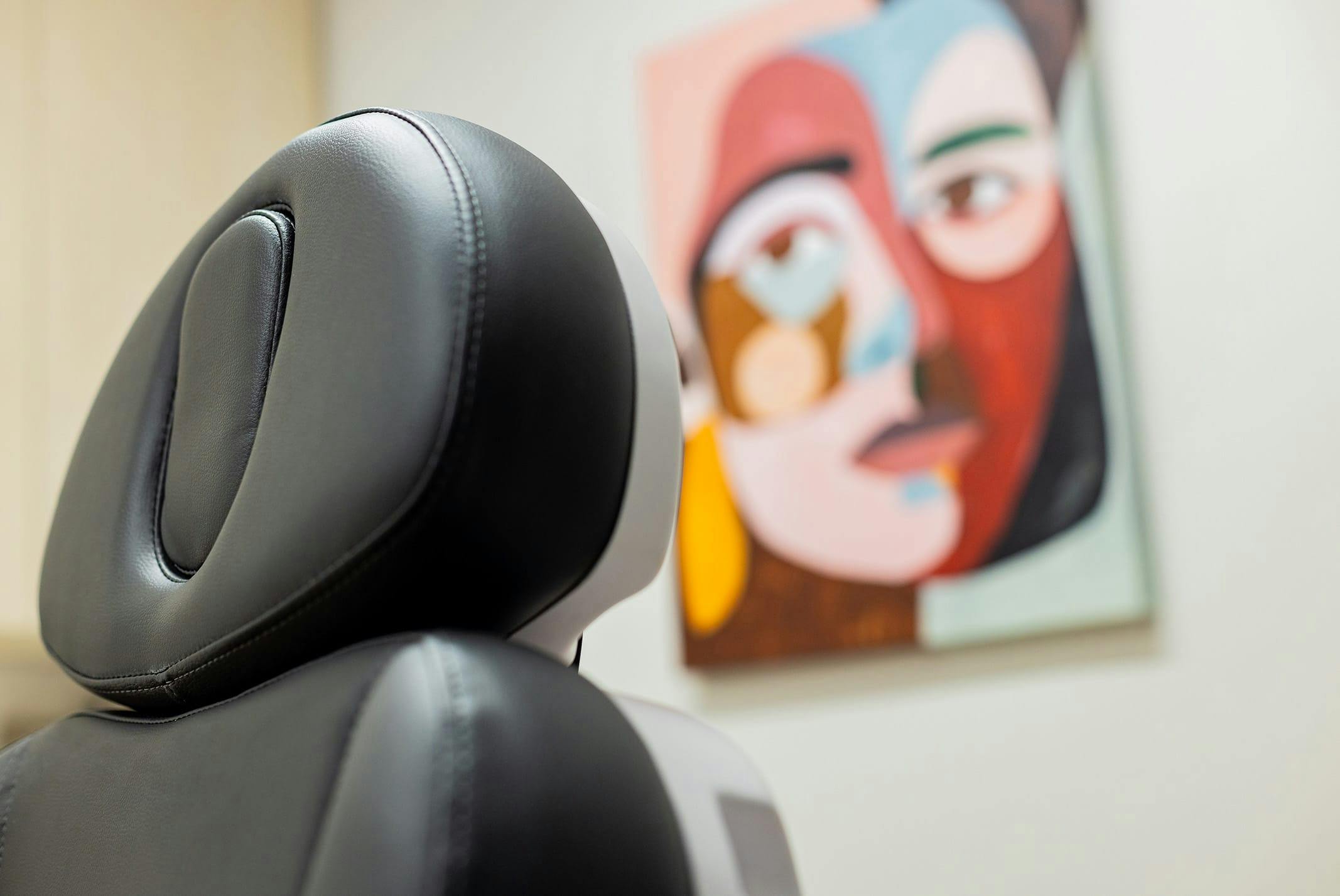 procedure chair with painting behind it