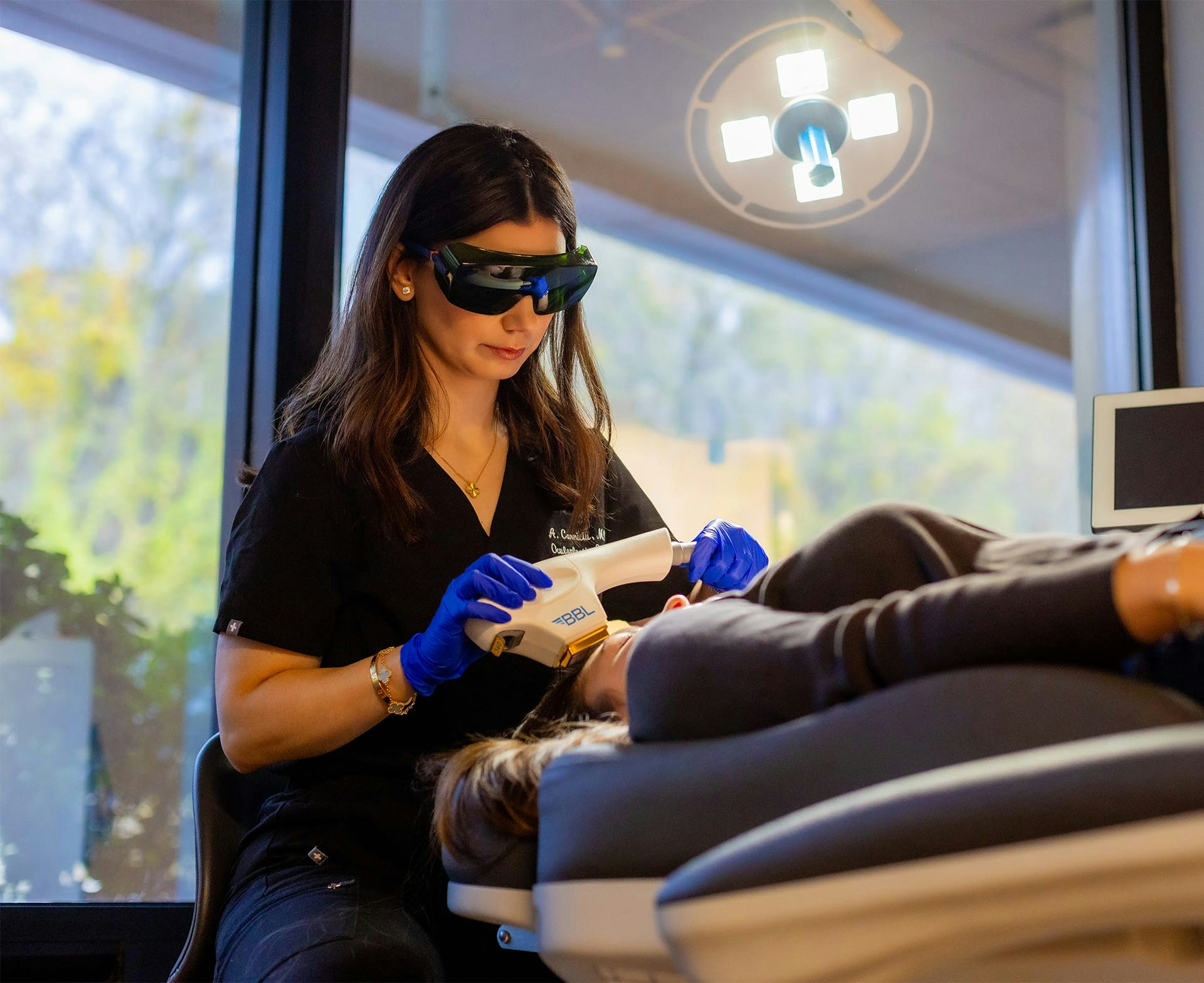 doctor treating patient with laser