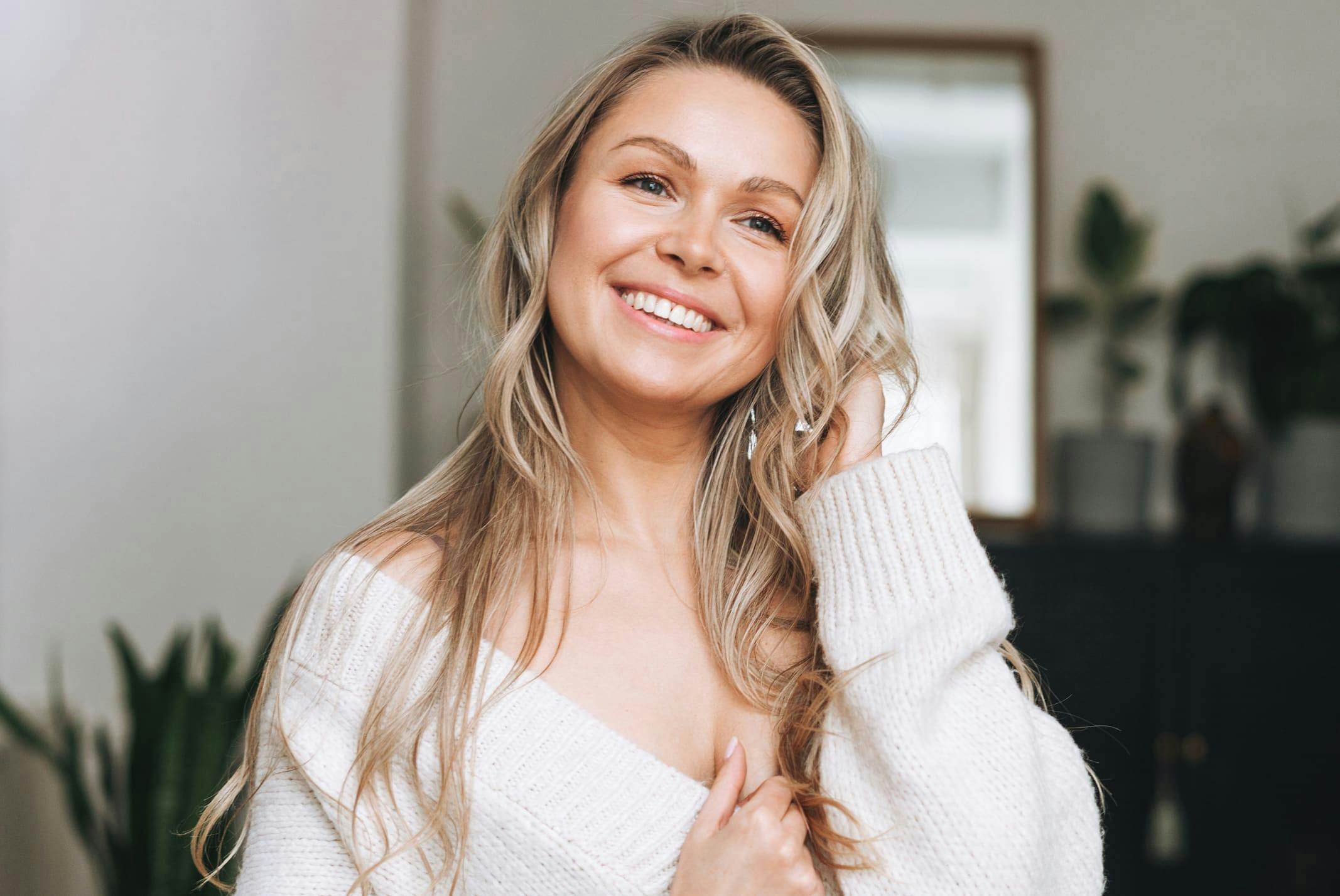 woman looking down at camera