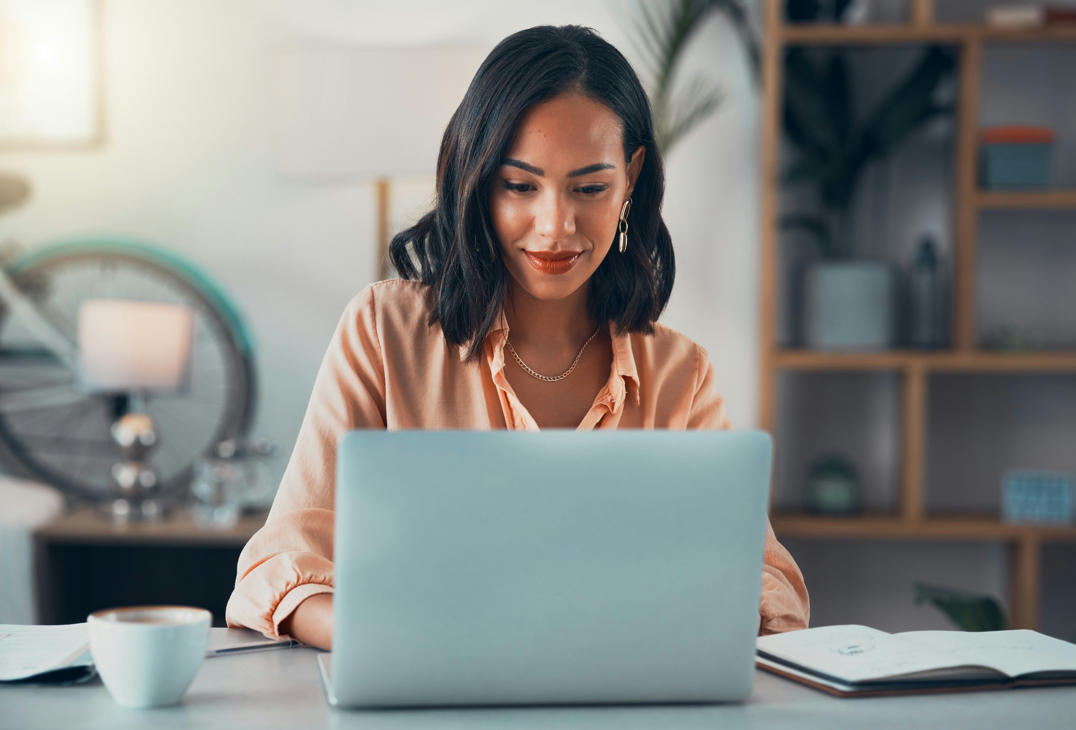 Woman typing on her laptop