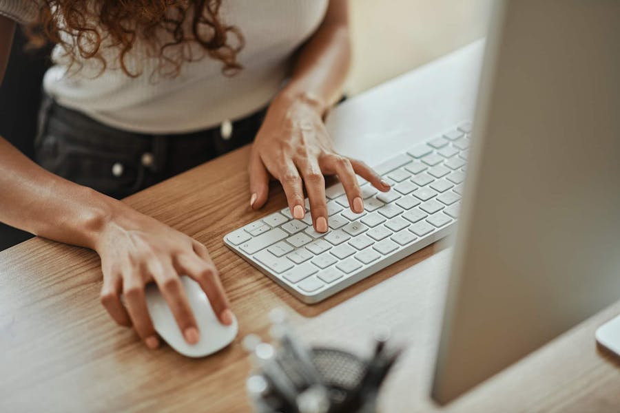woman typing on keyboard