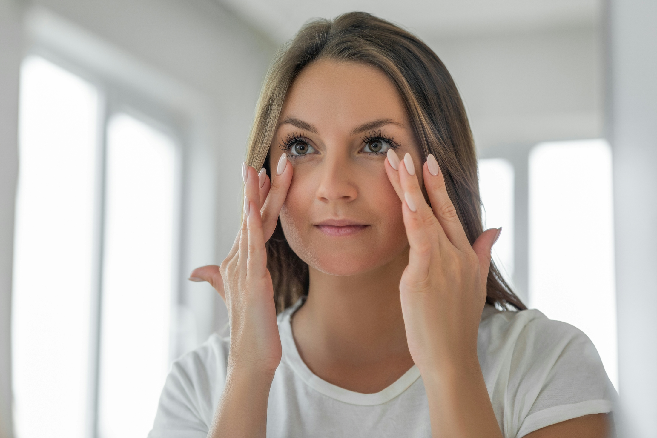 Woman touching her face