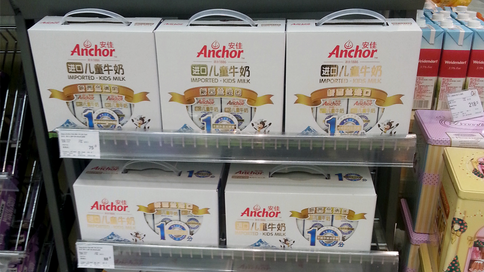 Anchor milk on sale in supermarket in China LR