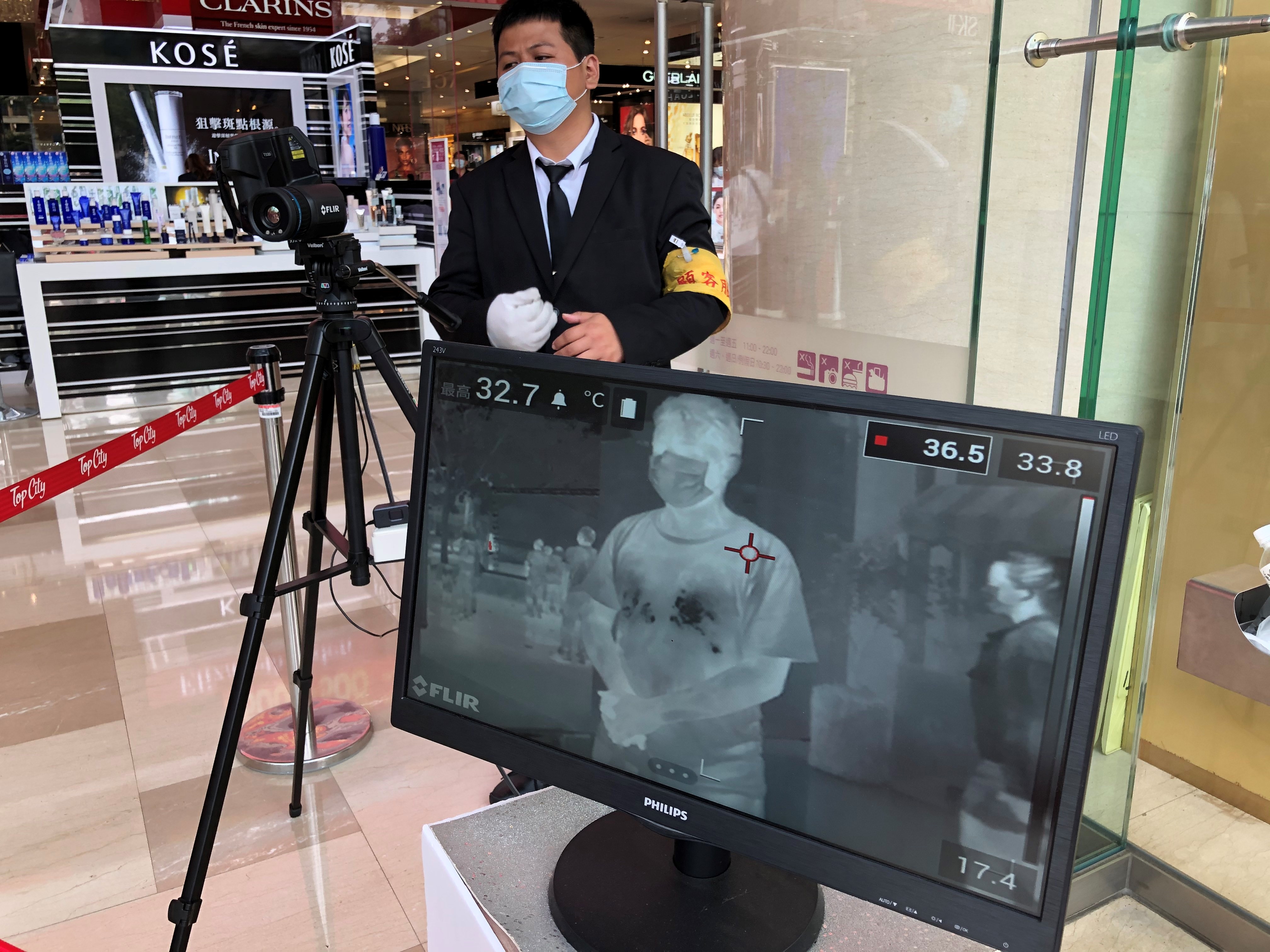 temperature check at Top City department store in Taichung Photo Ron Hanson