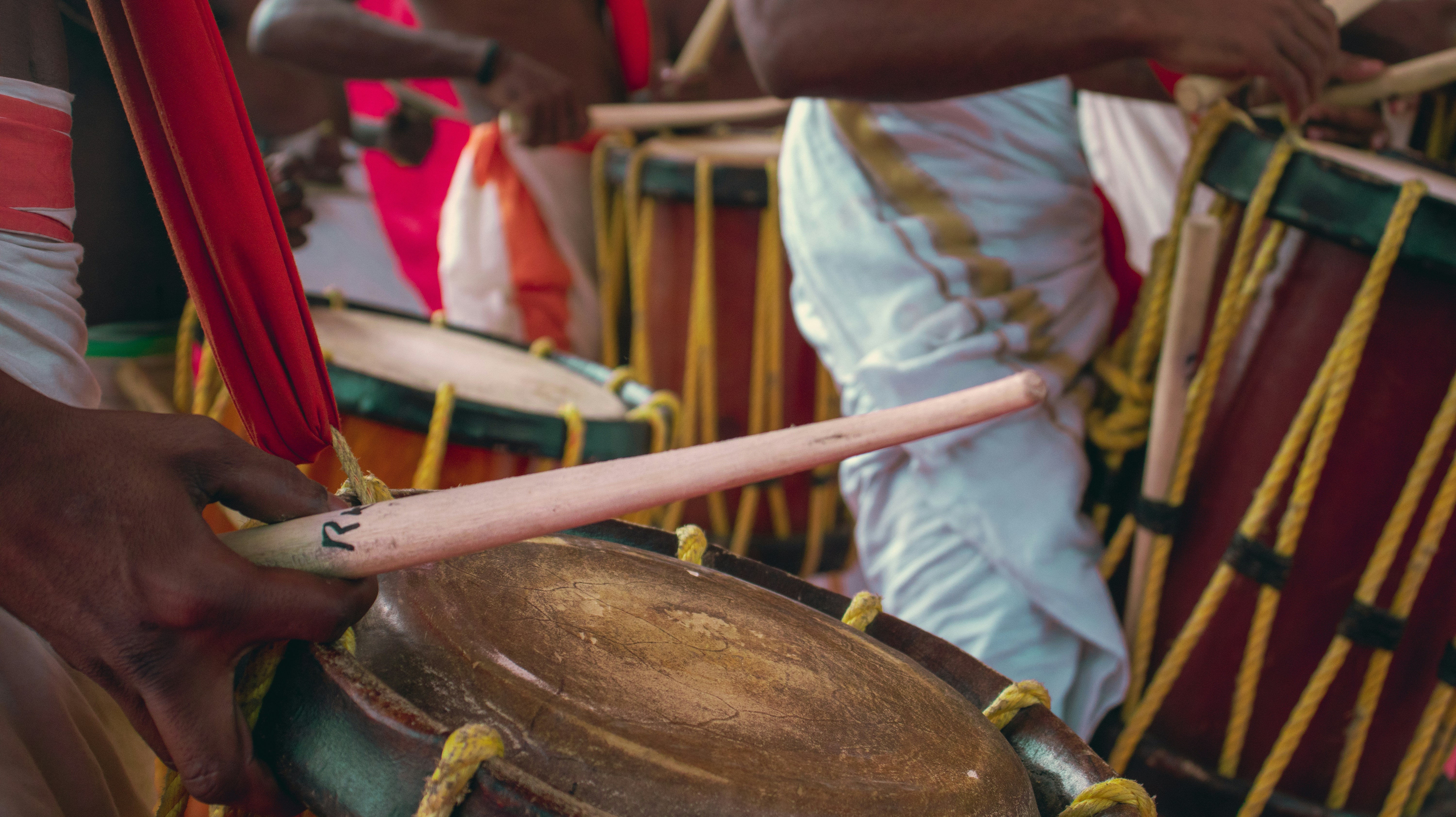 A close-up shot of a stick hitting a drum