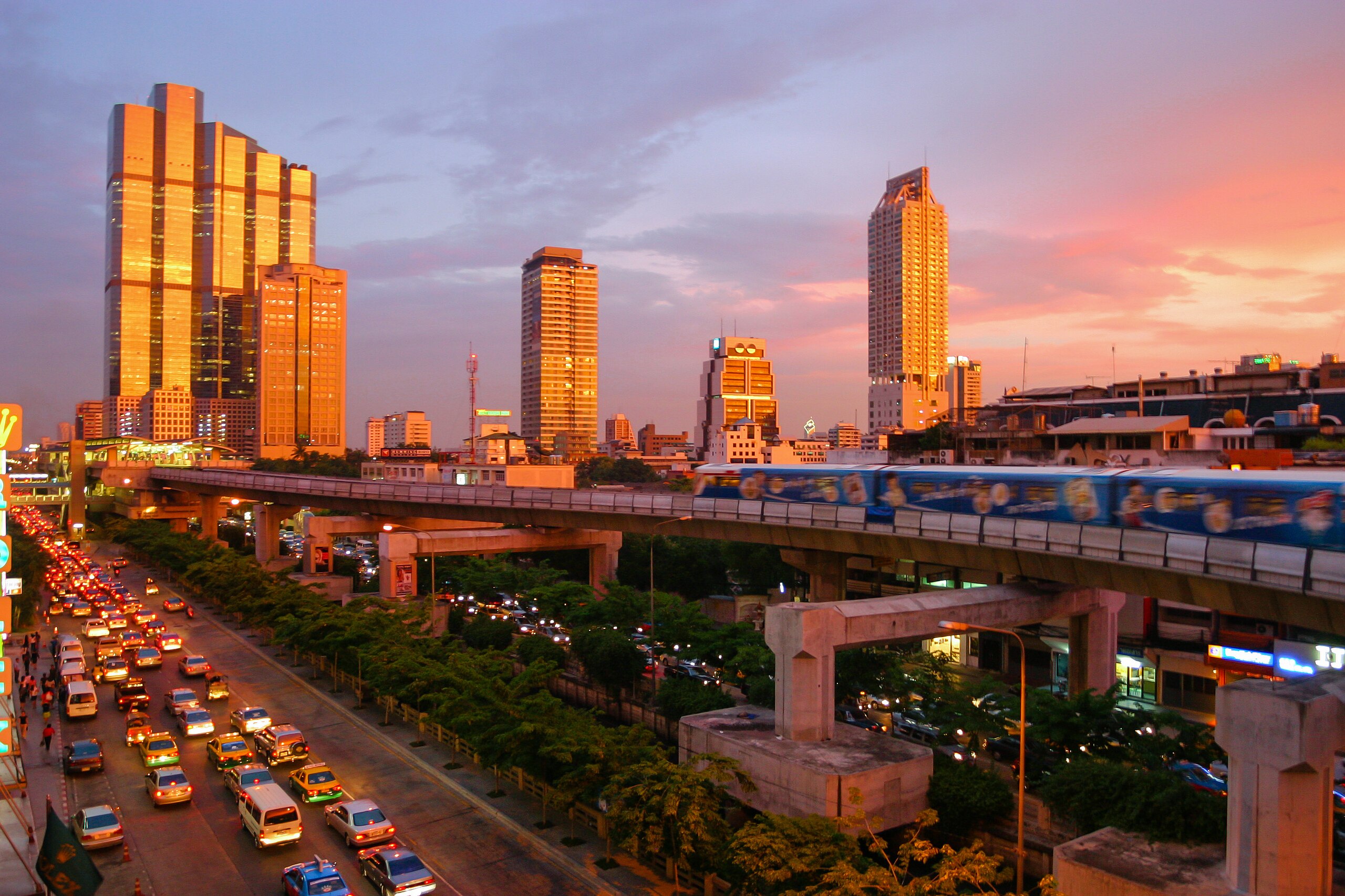 The city of Bangkok at sunset with light striking tall buildings