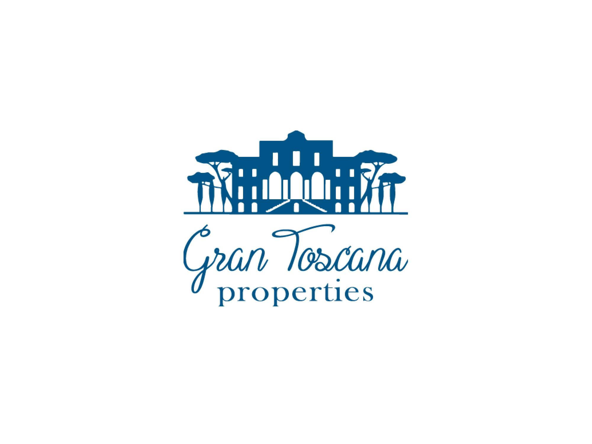 logo agenzia gran toscana properties