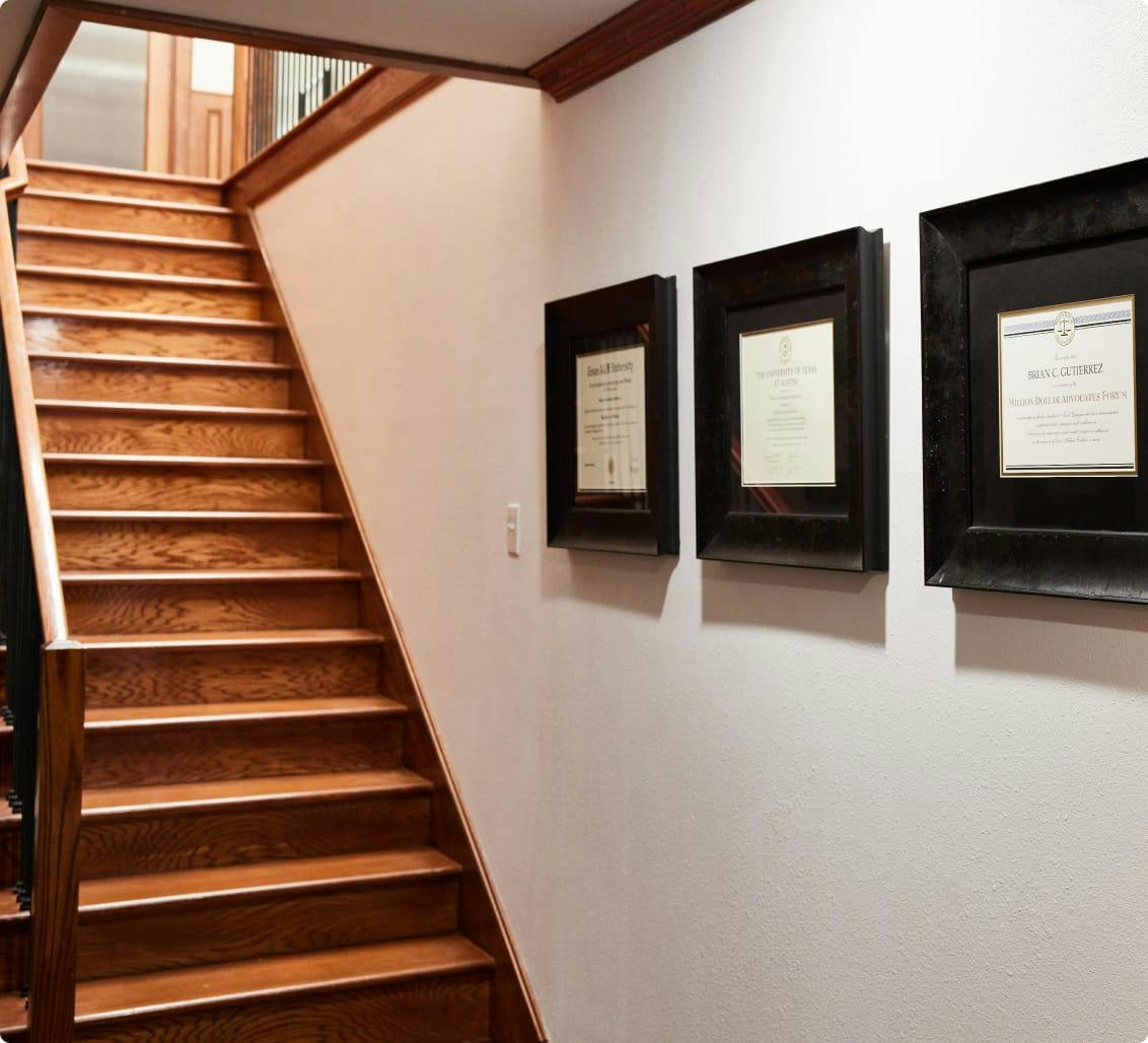 A staircase next to legal certifications