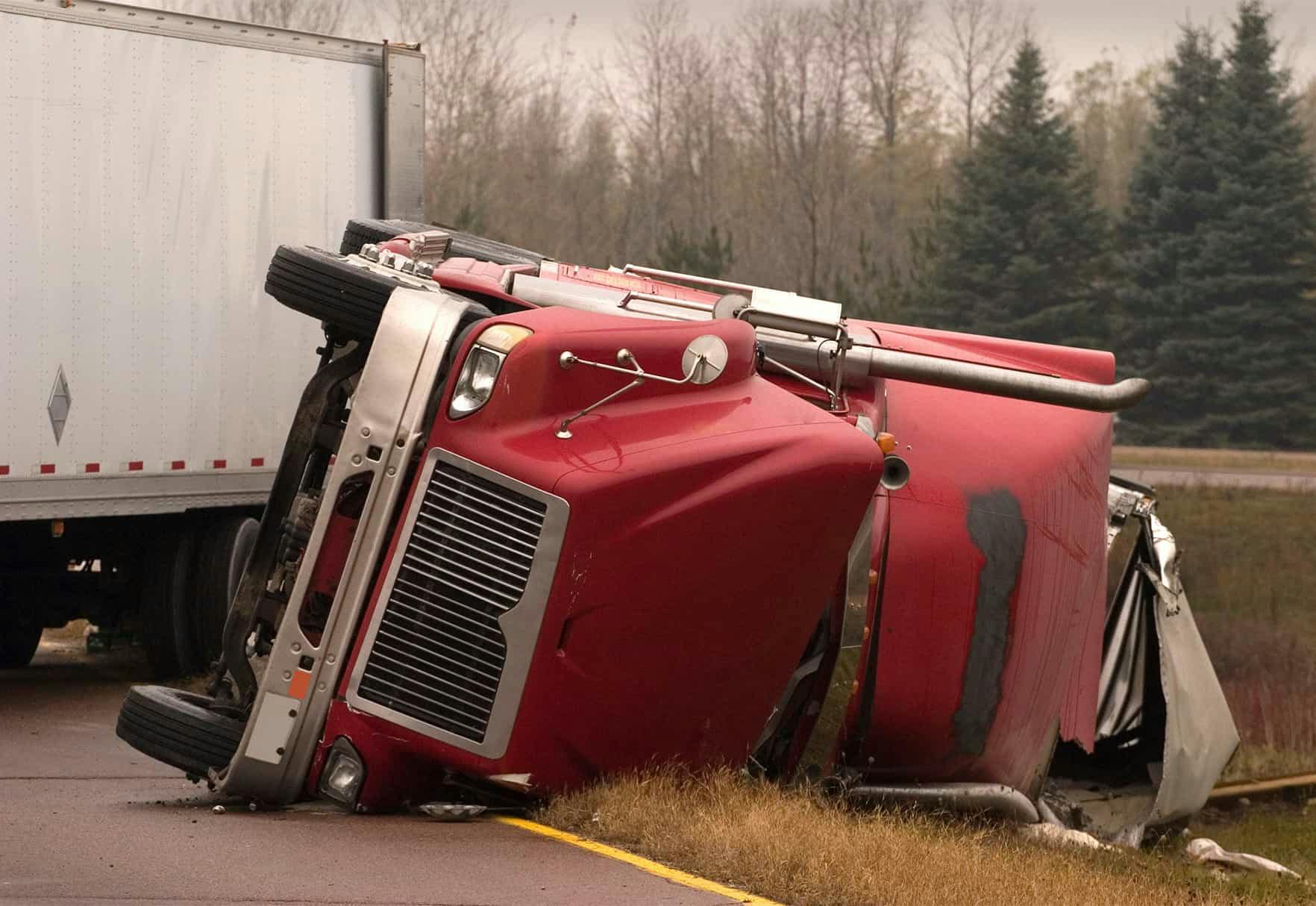 An 18-wheeler flipped on its side
