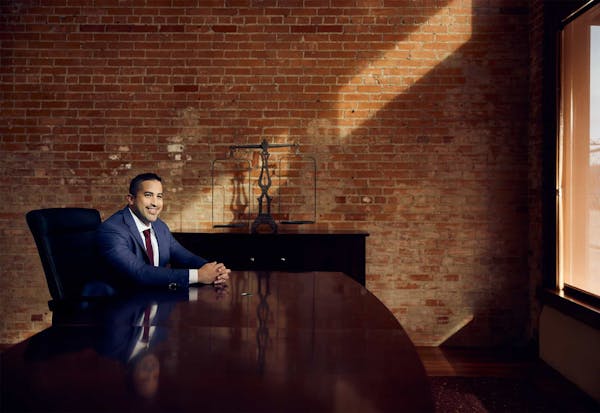 Brian Gutierrez sitting at a table