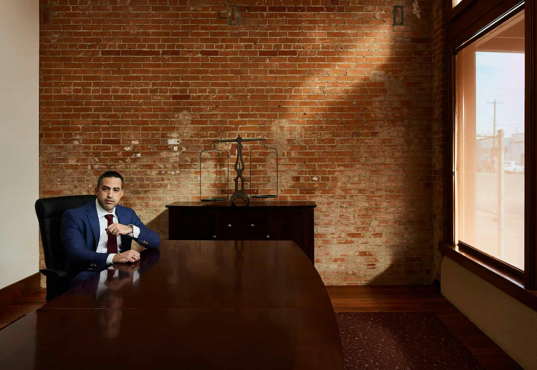 Brian Gutierrez sitting at a table