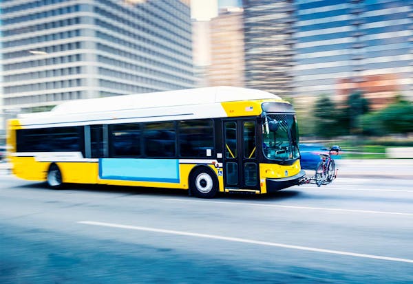 A bus driving through the city
