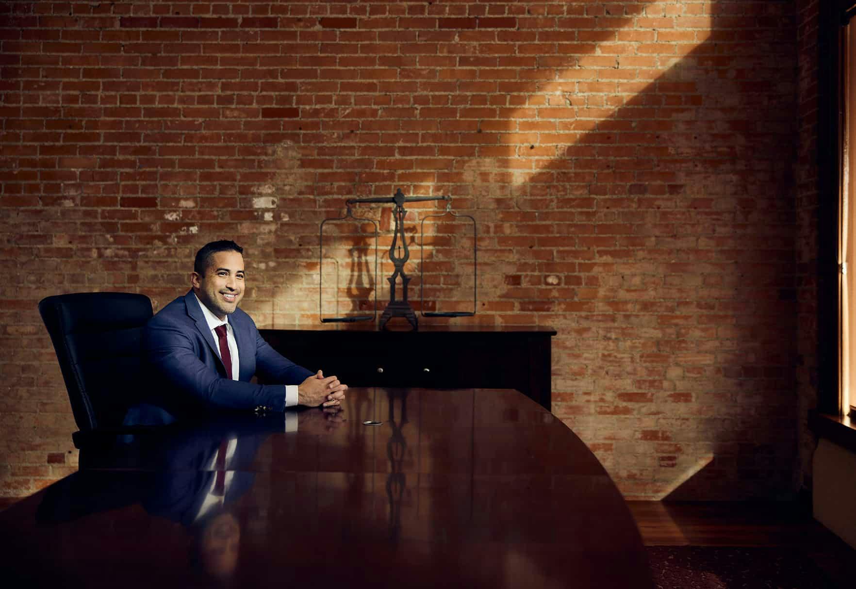 Brian Gutierrez sitting at a table