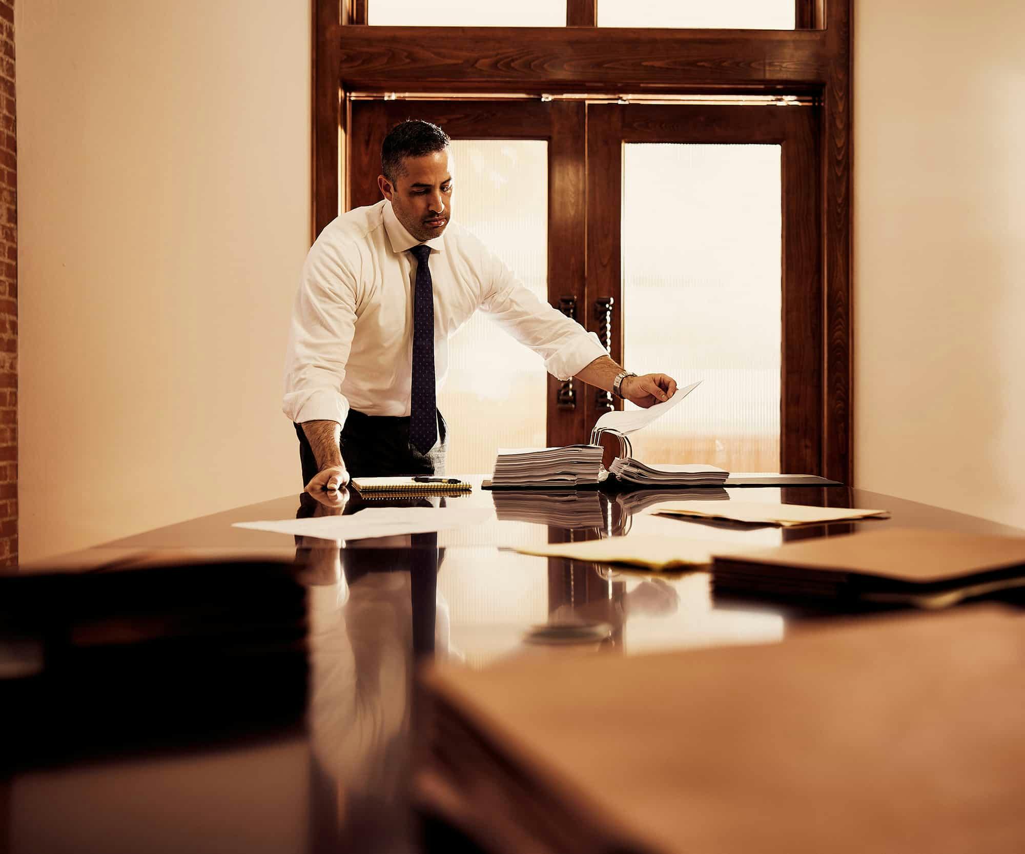 Brian Gutierrez at a desk looking at documents