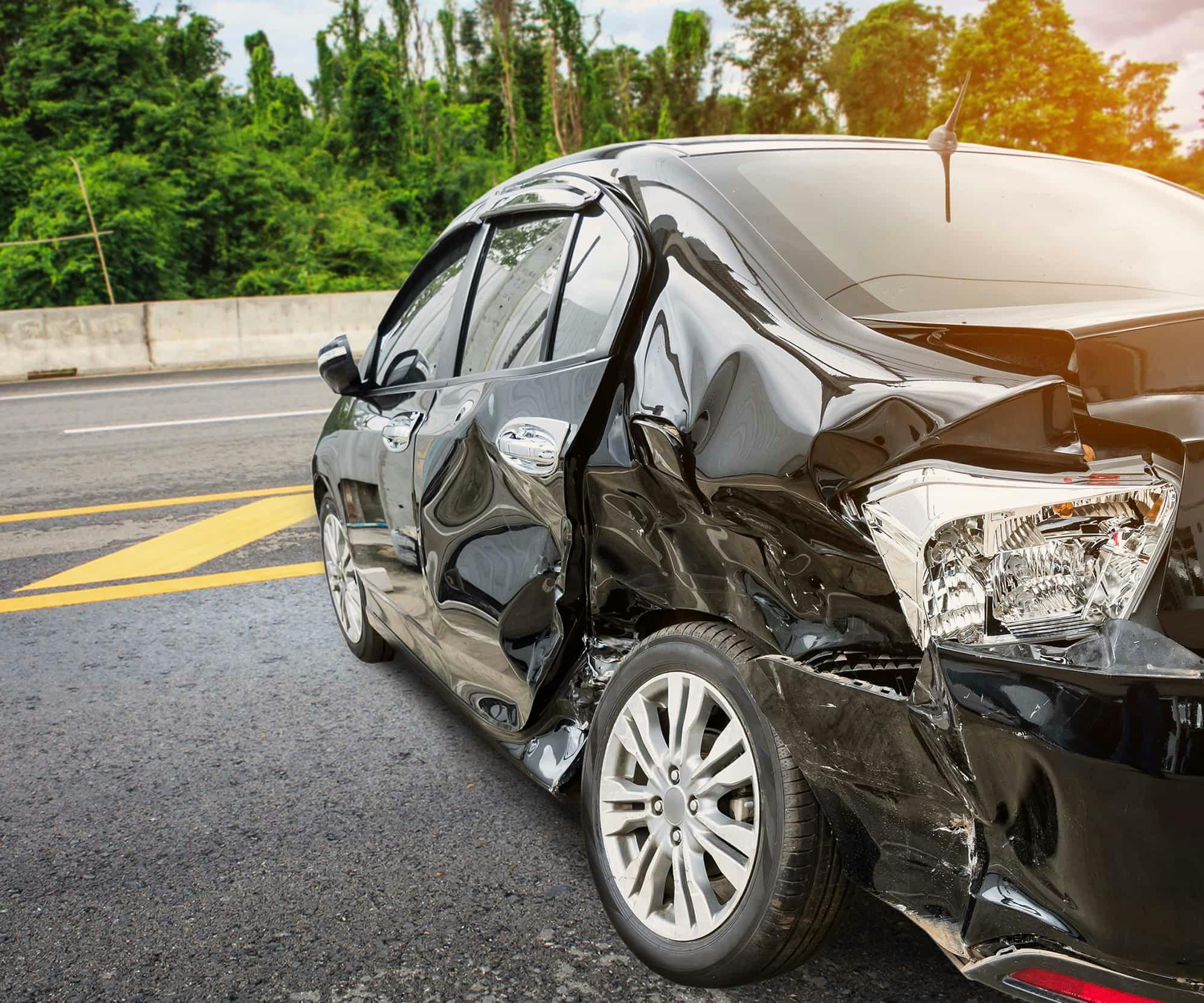 the heavily damaged side of a car