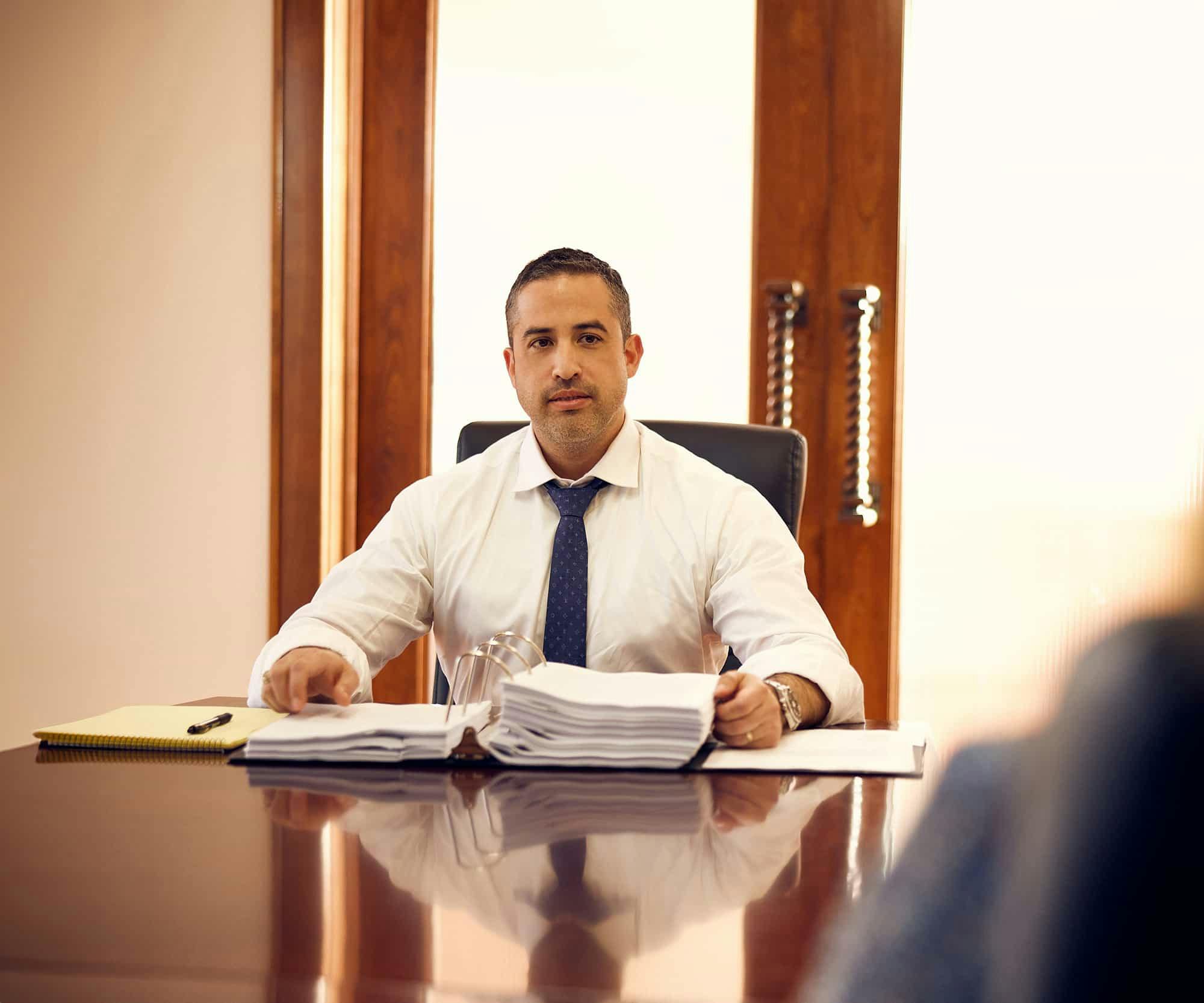 Brian Gutierrez sitting at a table with a client