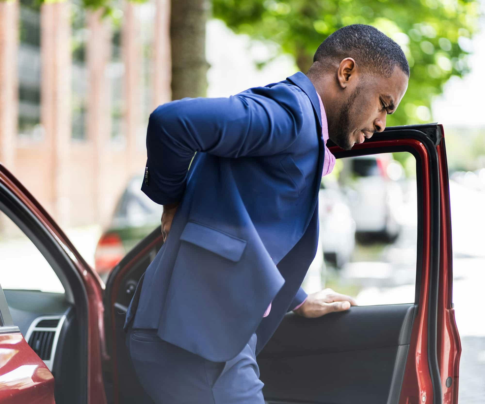 Man holding his back in pain