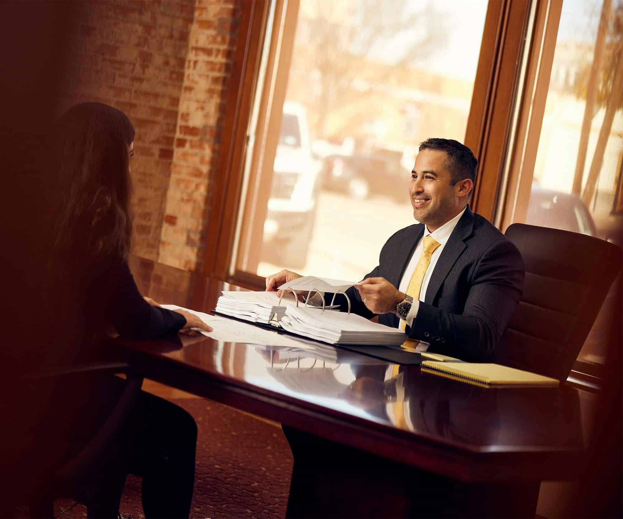 Brian Gutierrez talking to a client