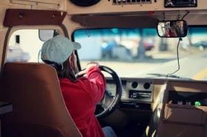 Someone driving a bus.