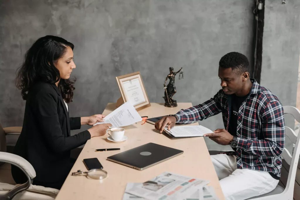 A client speaking with his attorney.