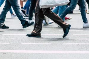 A pedestrian crossing the street.