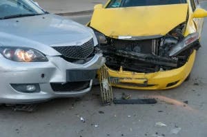 Two cars in a headon collision. The drivers are wondering how Texas handles car accident claims involving mutliple vehicles.