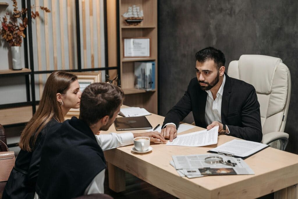 Attorney speaking with clients.