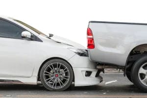 Two cars in a rear end accident with the drivers wondering when they will need to file their Texas car accident claim.