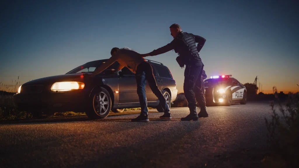 Someone getting arrested from a DUI.