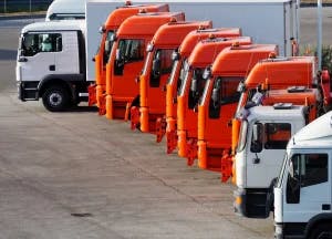 A line of semi trucks. Other drivers are wondering how fault is determined when a truck is involved in an accident.