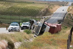 A semi-truck crash on the highway with the driver of a car wondering what happens if the trucking company disputes their claim.