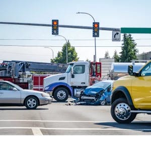 Commercial truck and car in an accident.